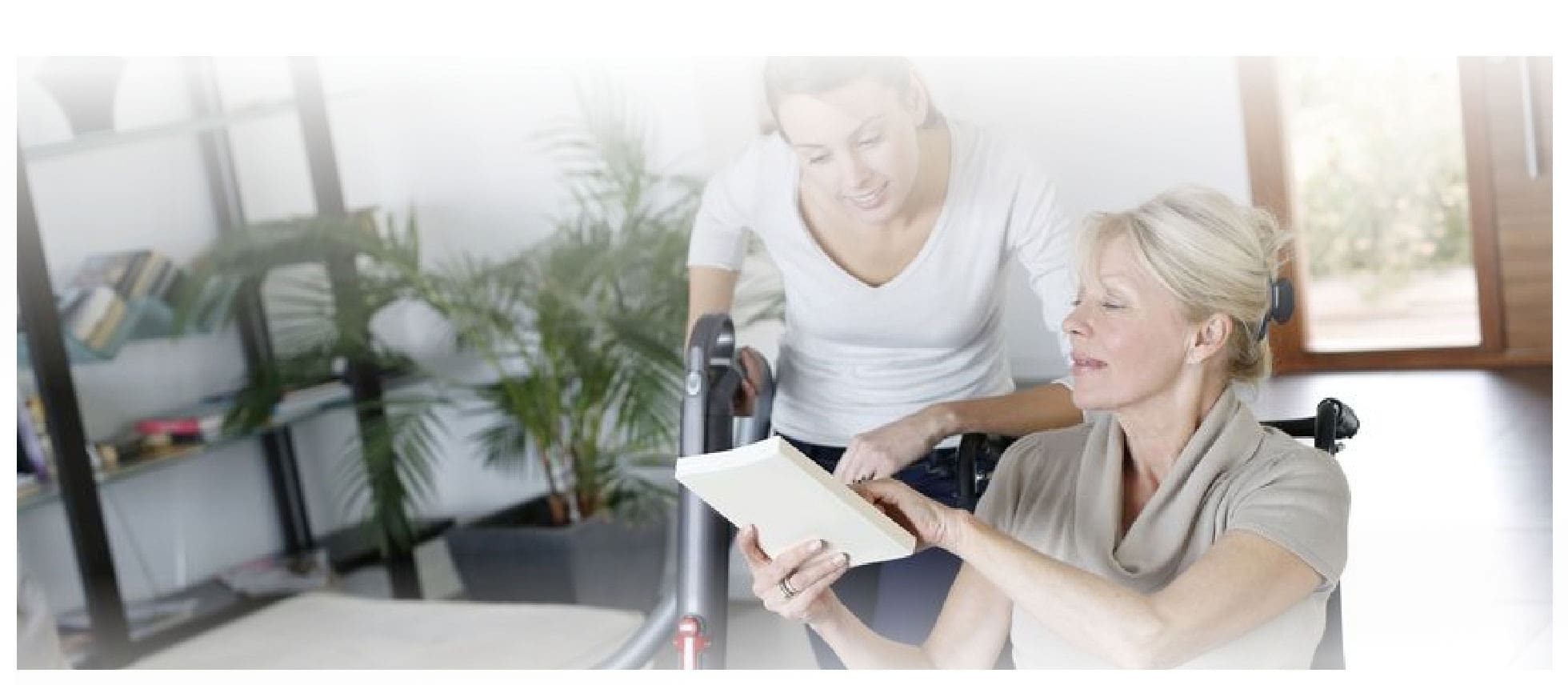 an old woman showing something written on the paper to a younger woman
